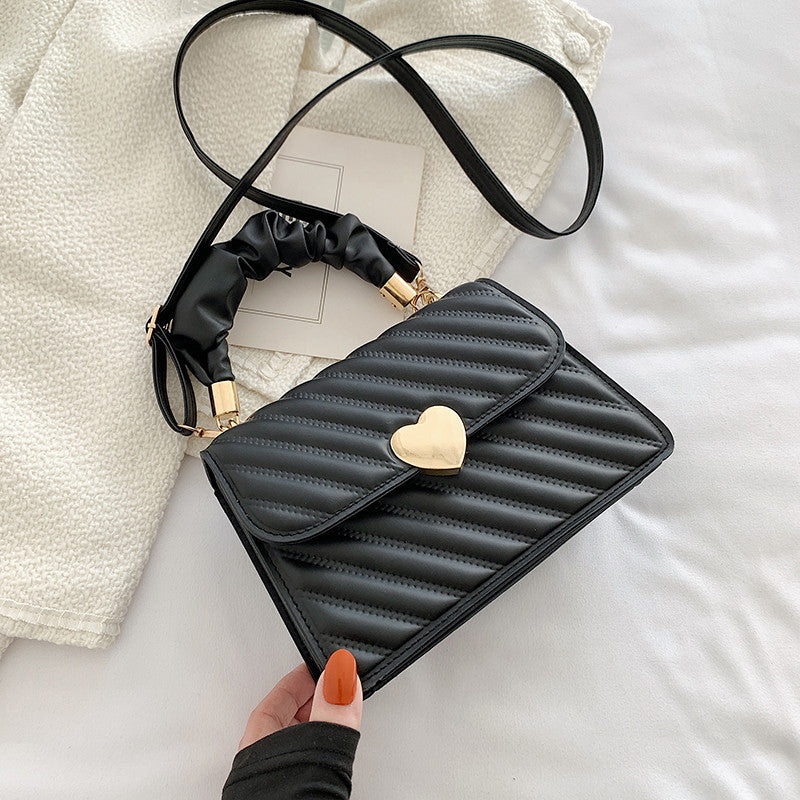 Elegante Handtasche mit Metal Design